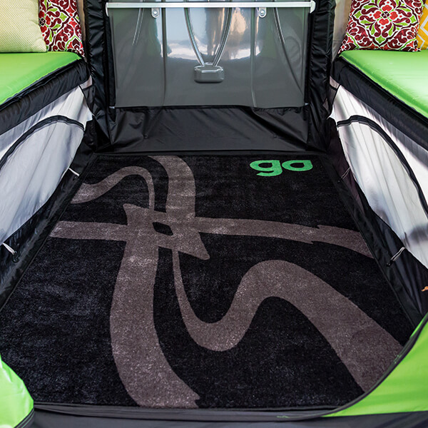 Does the twinkle toe rug fit in the roof compartment or gear deck for protecting from the elements while driving?